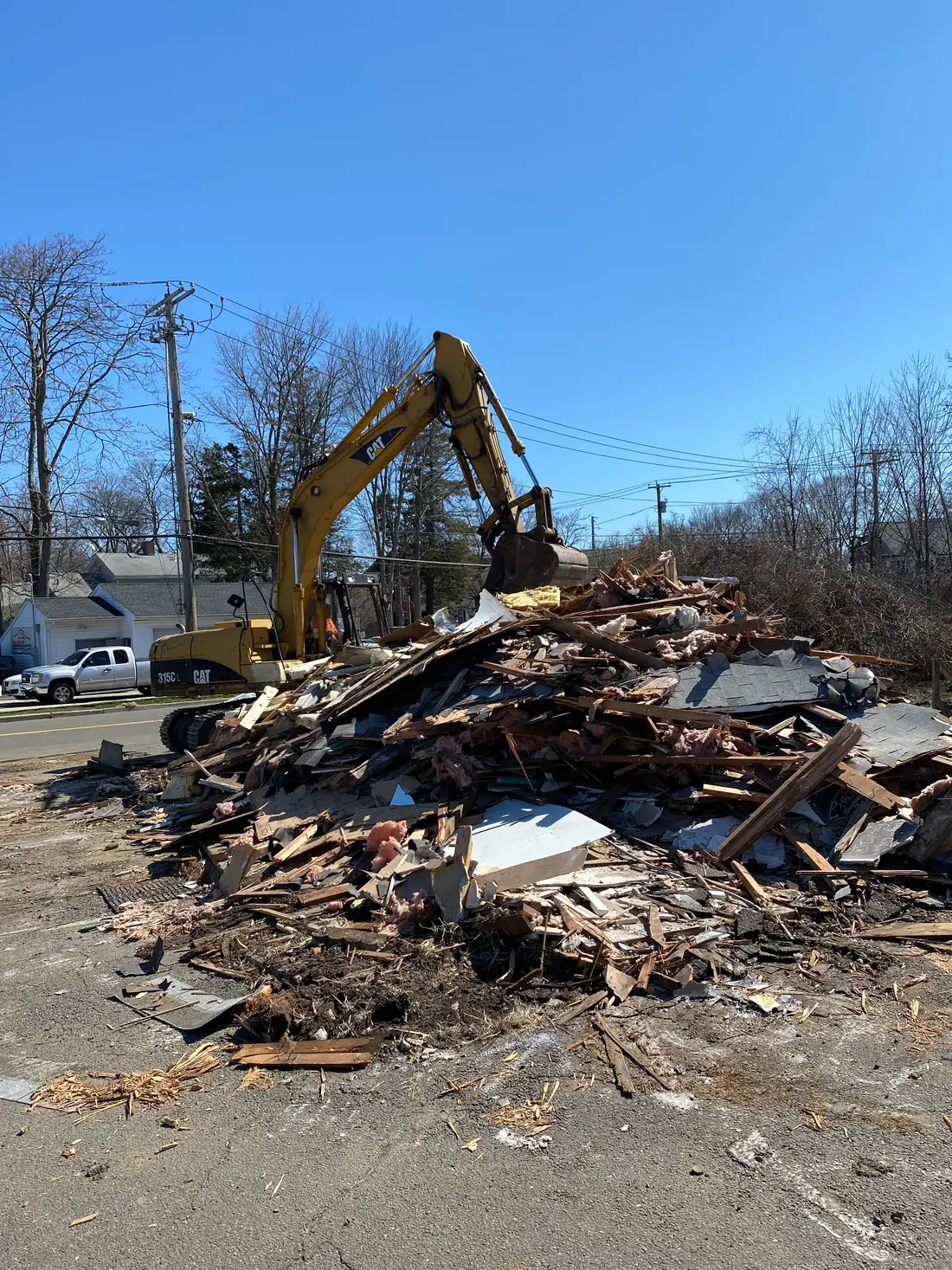 Sorted demolition debris staged for haul-away in Milford CT